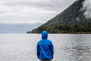 person standing in front of river 