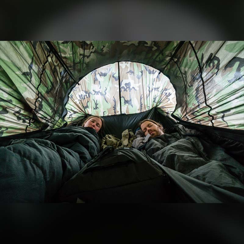 2 people sleeping in a double camping hammock