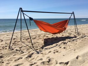 a hammock stand on a hot beach