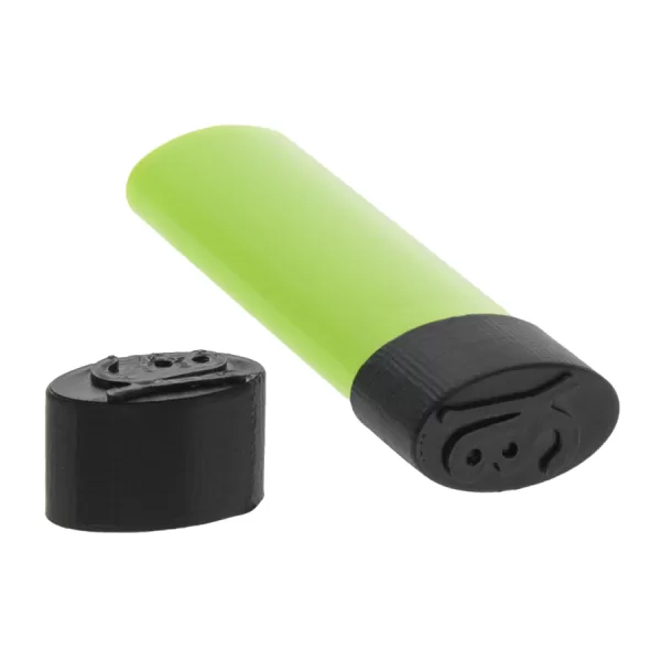 One green lighter laying flat with a black lighter cover sitting beside it.